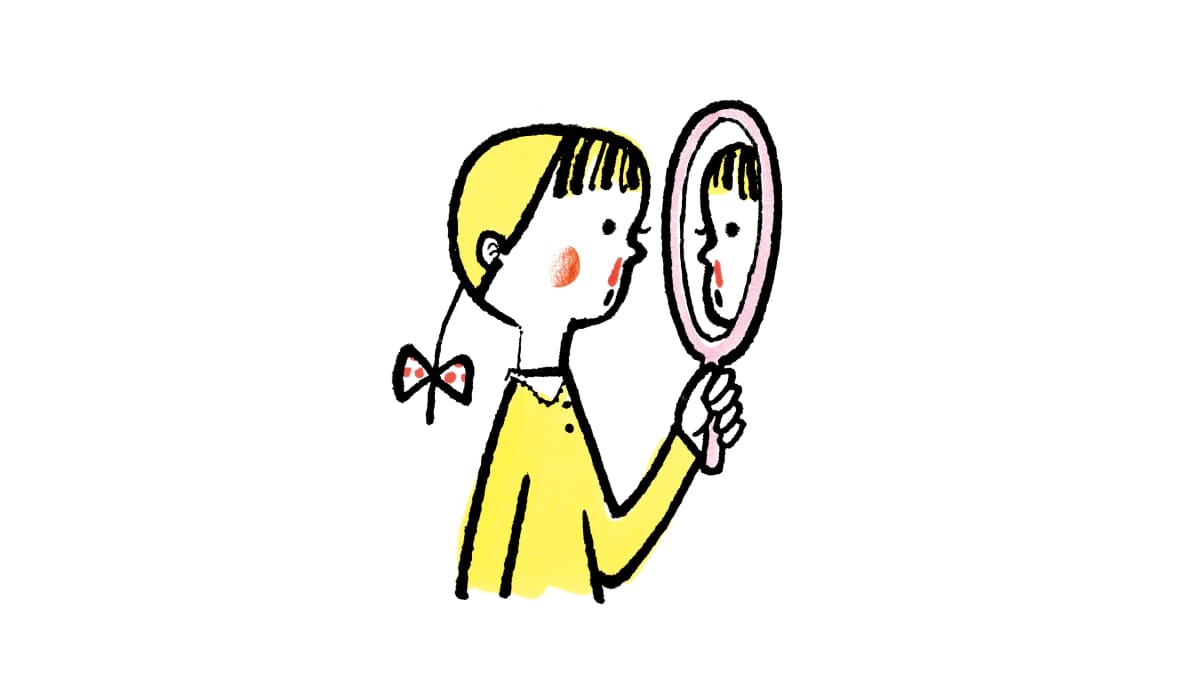 女の子が鼻血を流して鏡で見ている様子