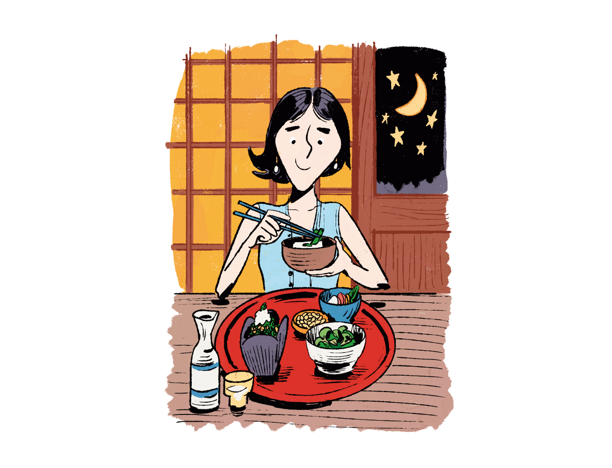 女性がおつまみに冷奴や酢の物を食べている様子